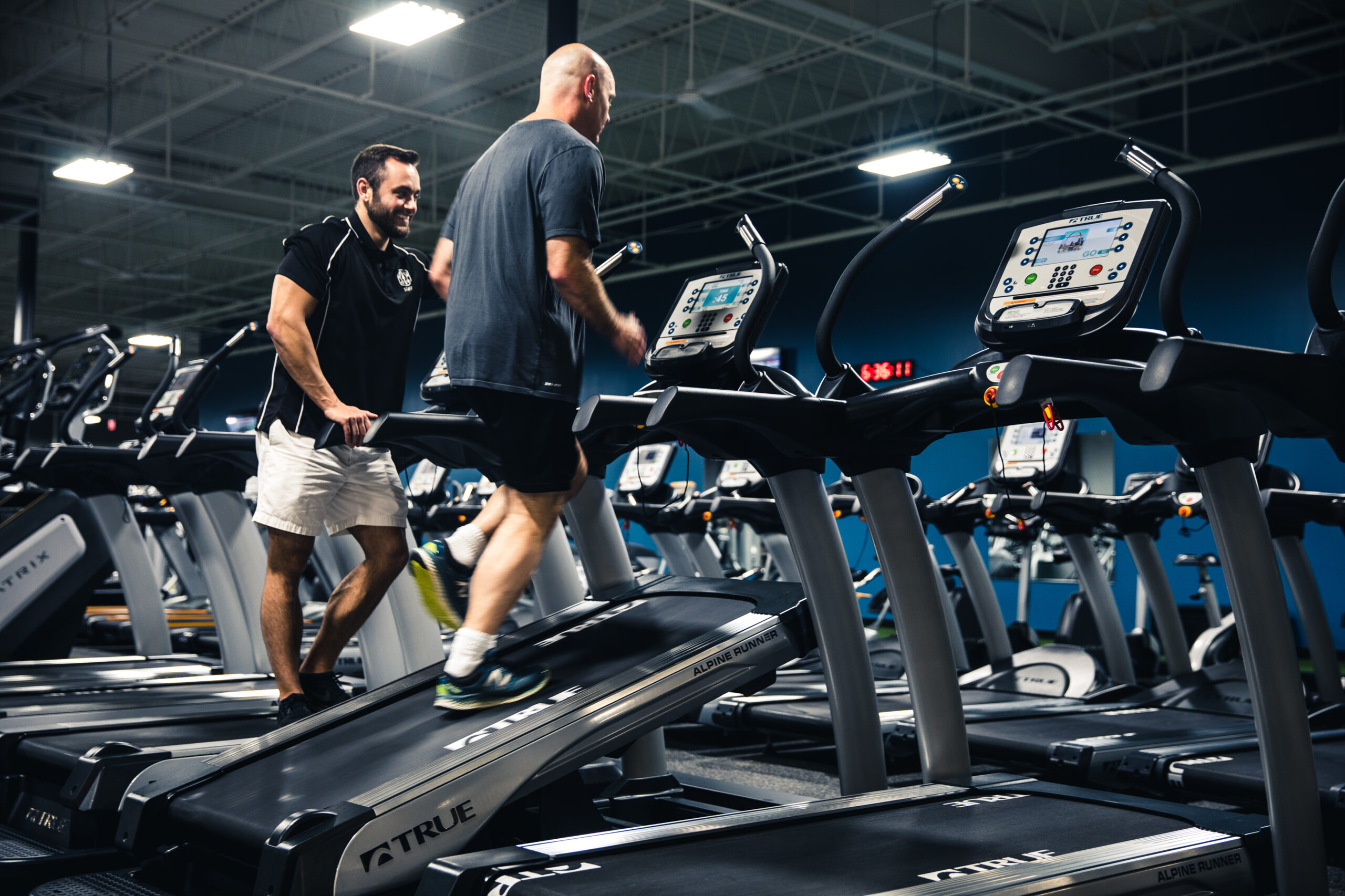 Athlete training with professional equipment in a focused fitness center environment