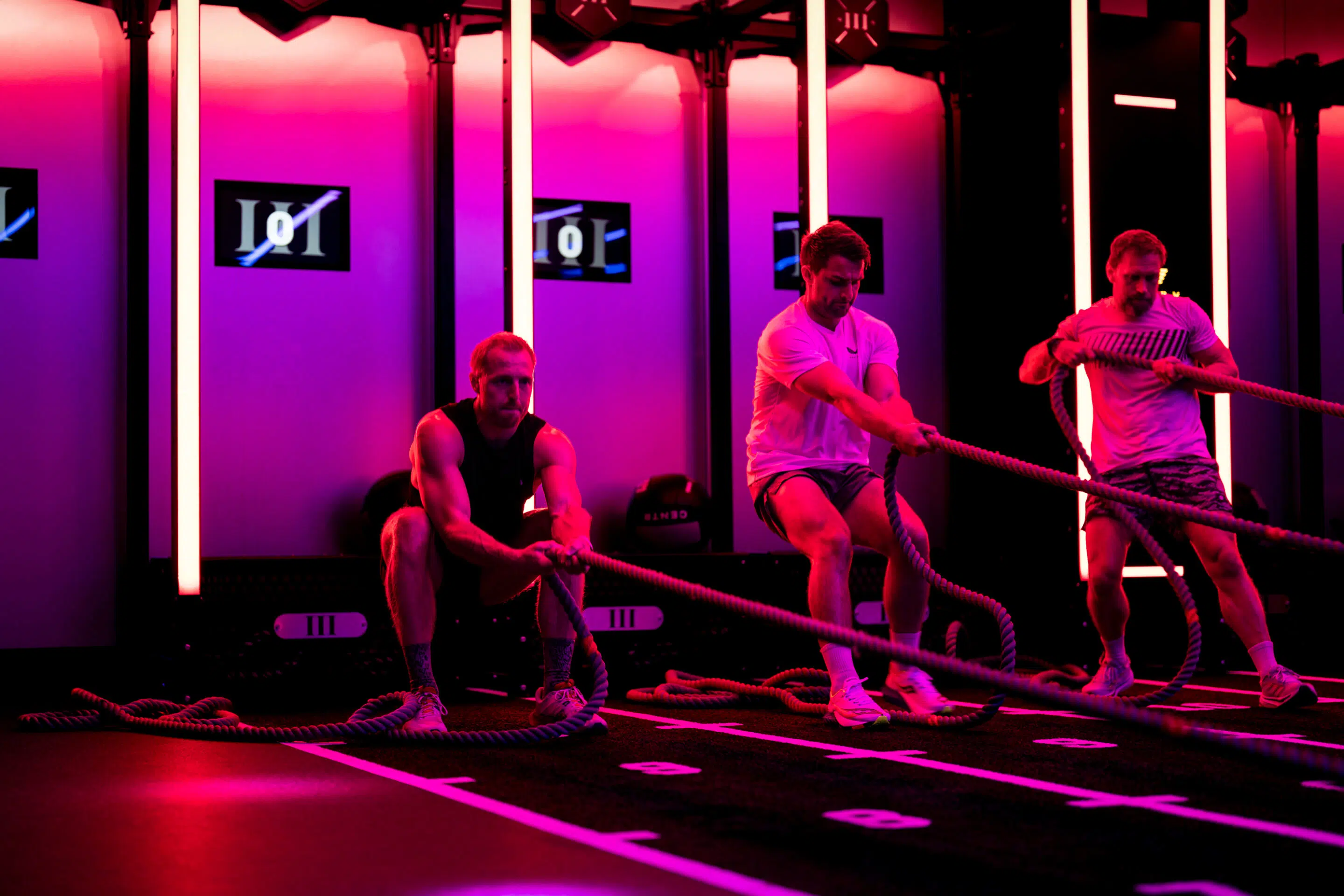 Athlete training with weights in a modern fitness center prepared for focused strength work