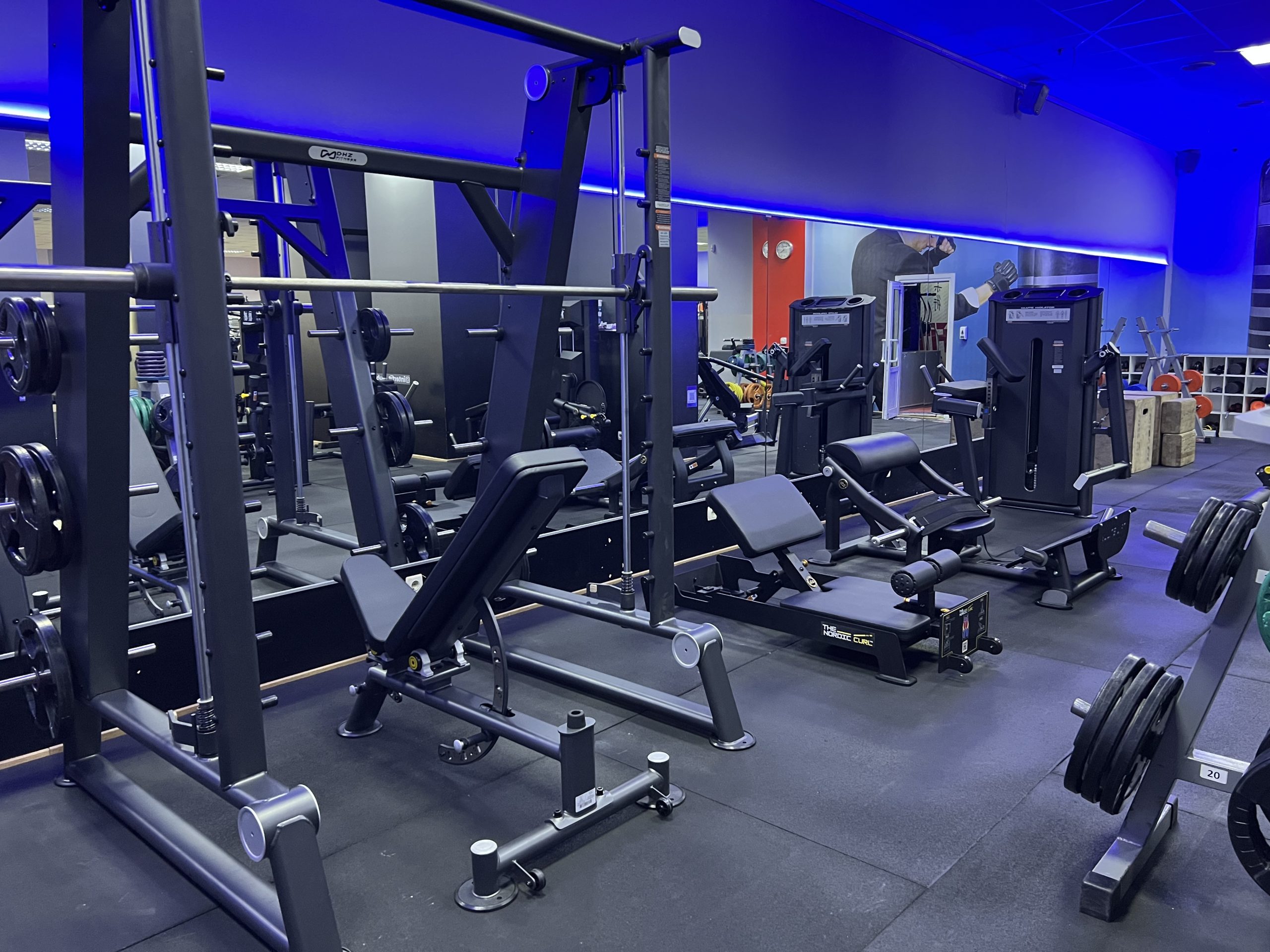 Athlete preparing for a structured workout inside a professional fitness center